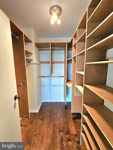 a view of closet area with empty racks