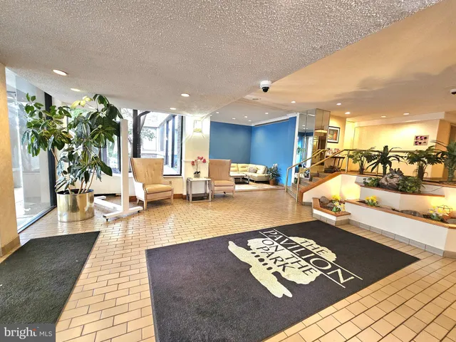 a view of a living room and kitchen