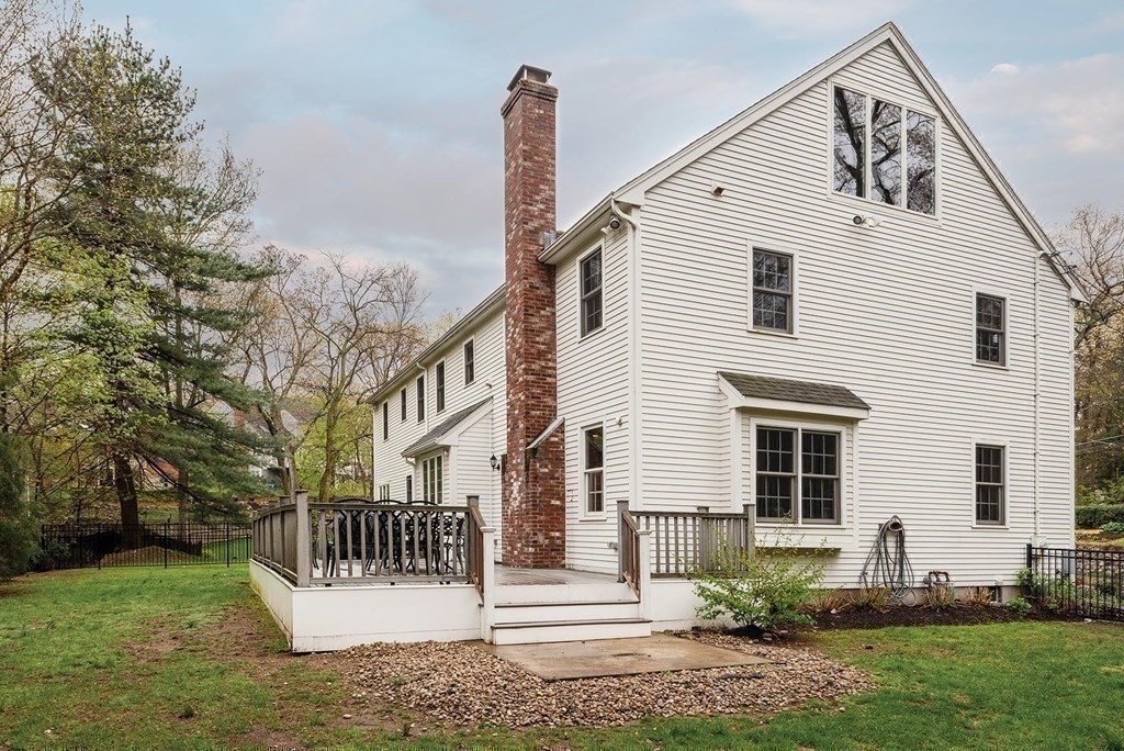 6 Oak Hill Road Needham, MA 02492 - Photo 18 of 18 a front view of a house with a fence