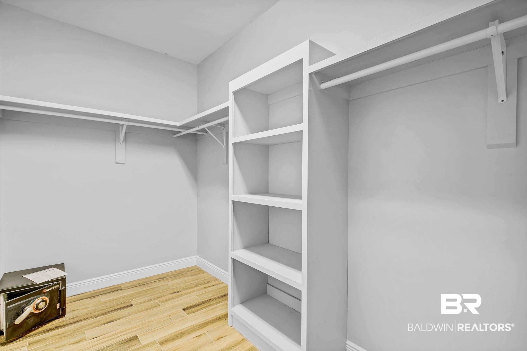 8145 Bay View Drive Foley, AL 36535 - Photo 37 of 81 Primary Closet has wood shelving and is off the primary bathroom.