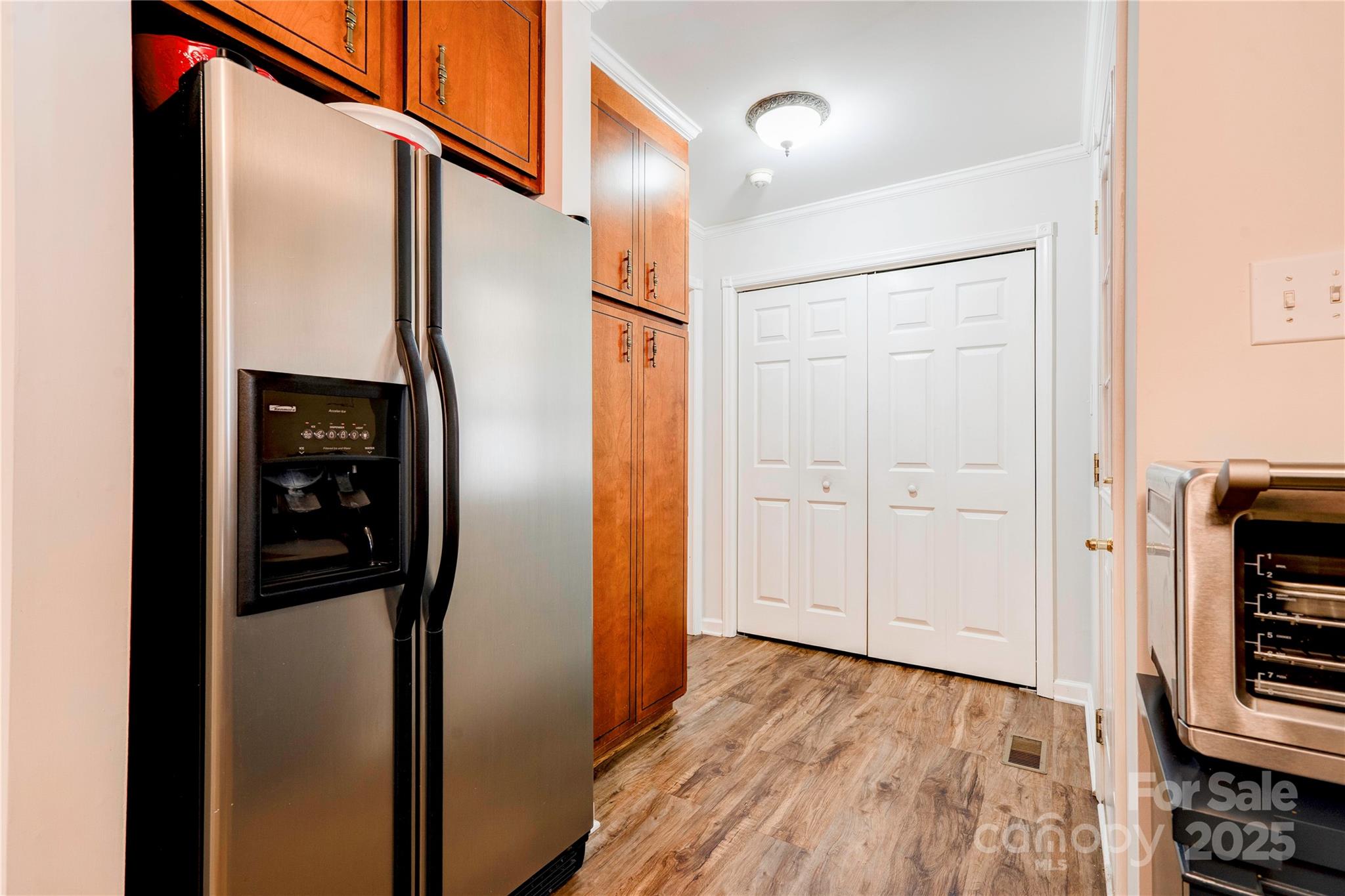 411 El Bethel Road Kings Mountain, NC 28086 - Photo 17 of 42 a view of a hallway with wooden floor and staircase