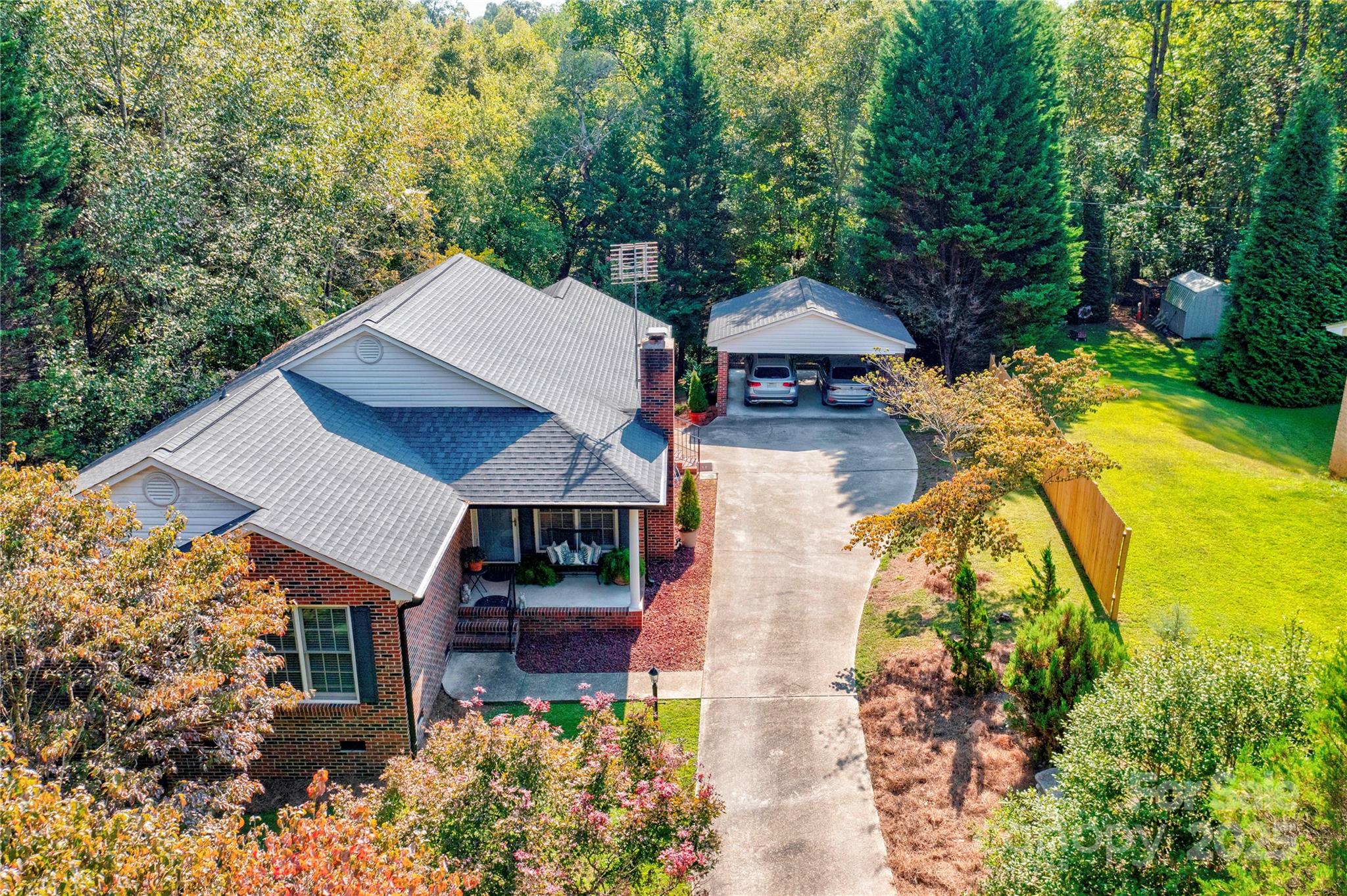 411 El Bethel Road Kings Mountain, NC 28086 - Photo 2 of 42 an aerial view of a house with swimming pool garden and patio