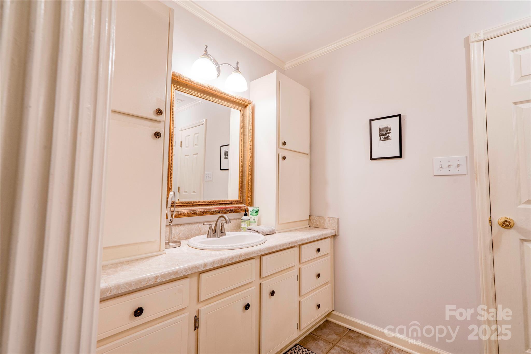 411 El Bethel Road Kings Mountain, NC 28086 - Photo 28 of 42 a bathroom with a double vanity sink and mirror