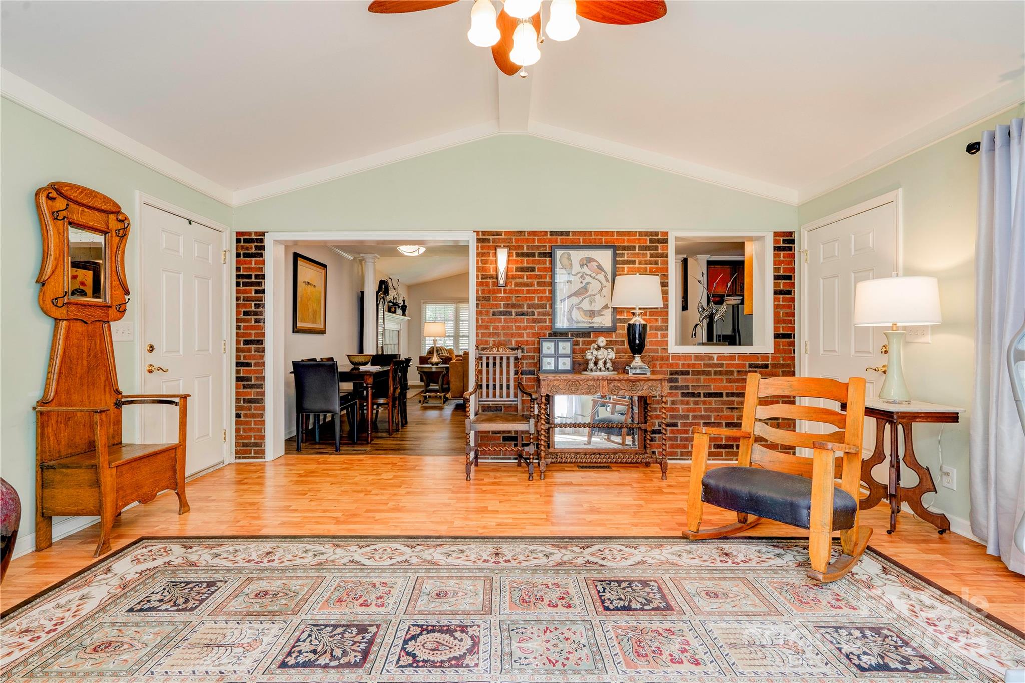 411 El Bethel Road Kings Mountain, NC 28086 - Photo 31 of 42 a living room with furniture a rug and a chandelier