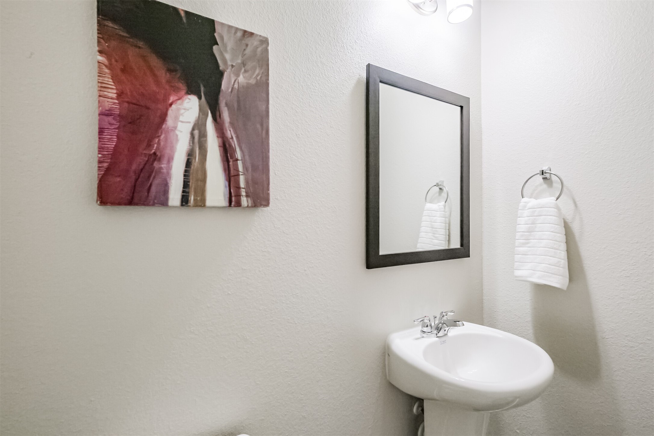 703 Majestic Eagle Court Houston, TX 77090 - Photo 19 of 40 a bathroom with a sink and a mirror