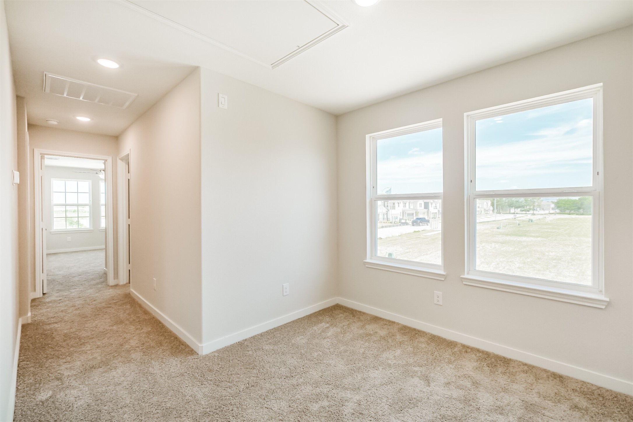 703 Majestic Eagle Court Houston, TX 77090 - Photo 20 of 40 a view of an empty room with a window
