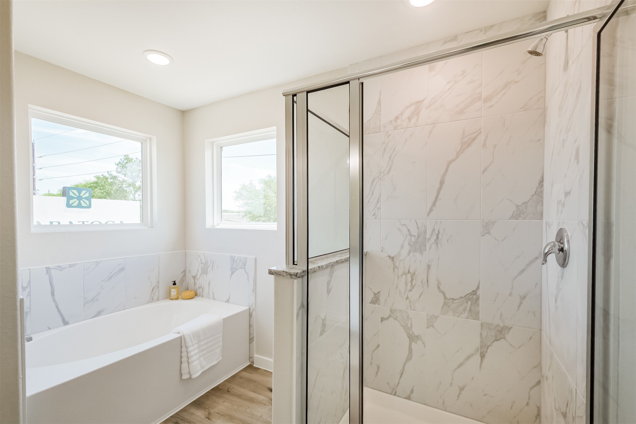 703 Majestic Eagle Court Houston, TX 77090 - Photo 24 of 40 a bathroom with a bathtub and a shower