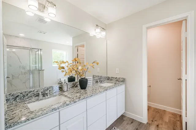 a bathroom with a bathtub and a window