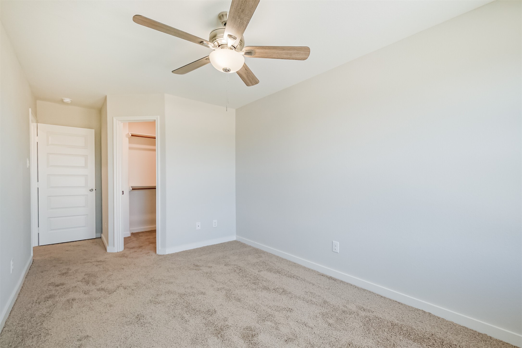 703 Majestic Eagle Court Houston, TX 77090 - Photo 29 of 40 an empty room with a ceiling fan and a window