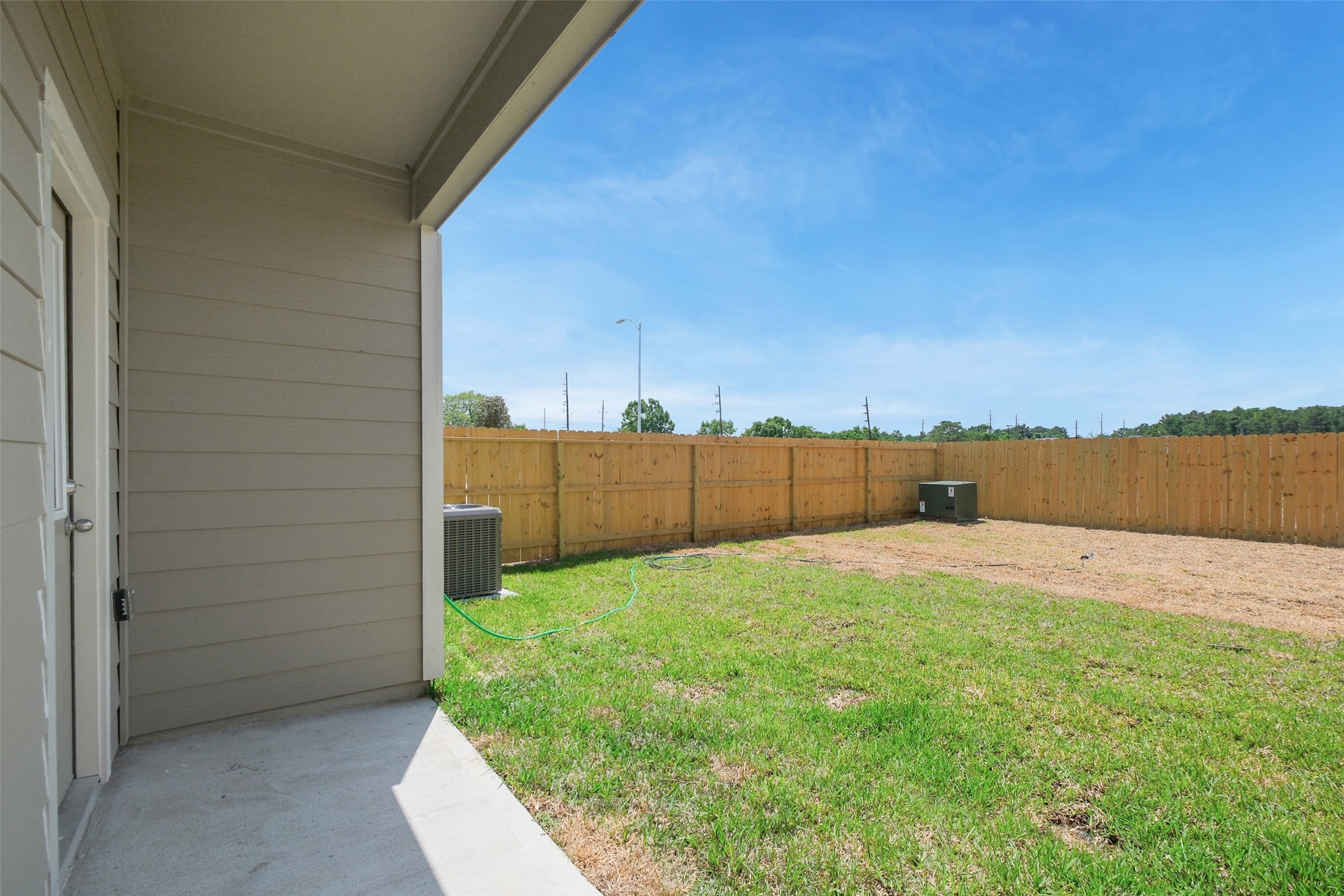 703 Majestic Eagle Court Houston, TX 77090 - Photo 35 of 40 a backyard of a house with lots of green space