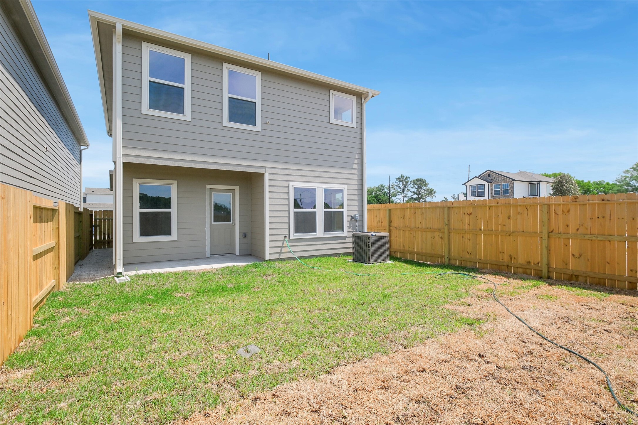 703 Majestic Eagle Court Houston, TX 77090 - Photo 38 of 40 a view of a house with a backyard