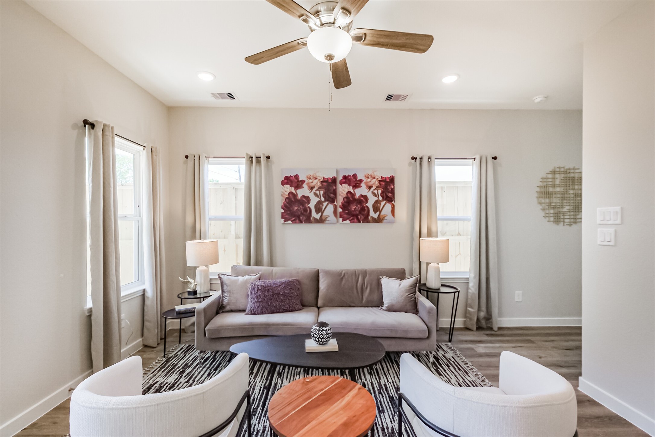 703 Majestic Eagle Court Houston, TX 77090 - Photo 7 of 40 a living room with furniture and a potted plant