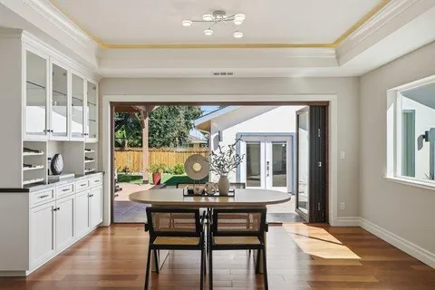 a view of a house with a yard and garage