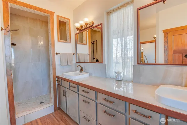 a view of walk in closet with clothes