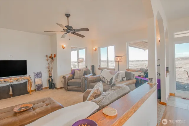 a view of a dining room with furniture wooden floor and chandelier