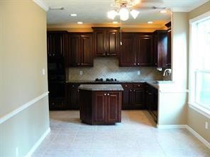 951 Lamonte Lane Houston, TX 77018 - Photo 12 of 26 a kitchen with stainless steel appliances granite countertop a stove a sink and a refrigerator