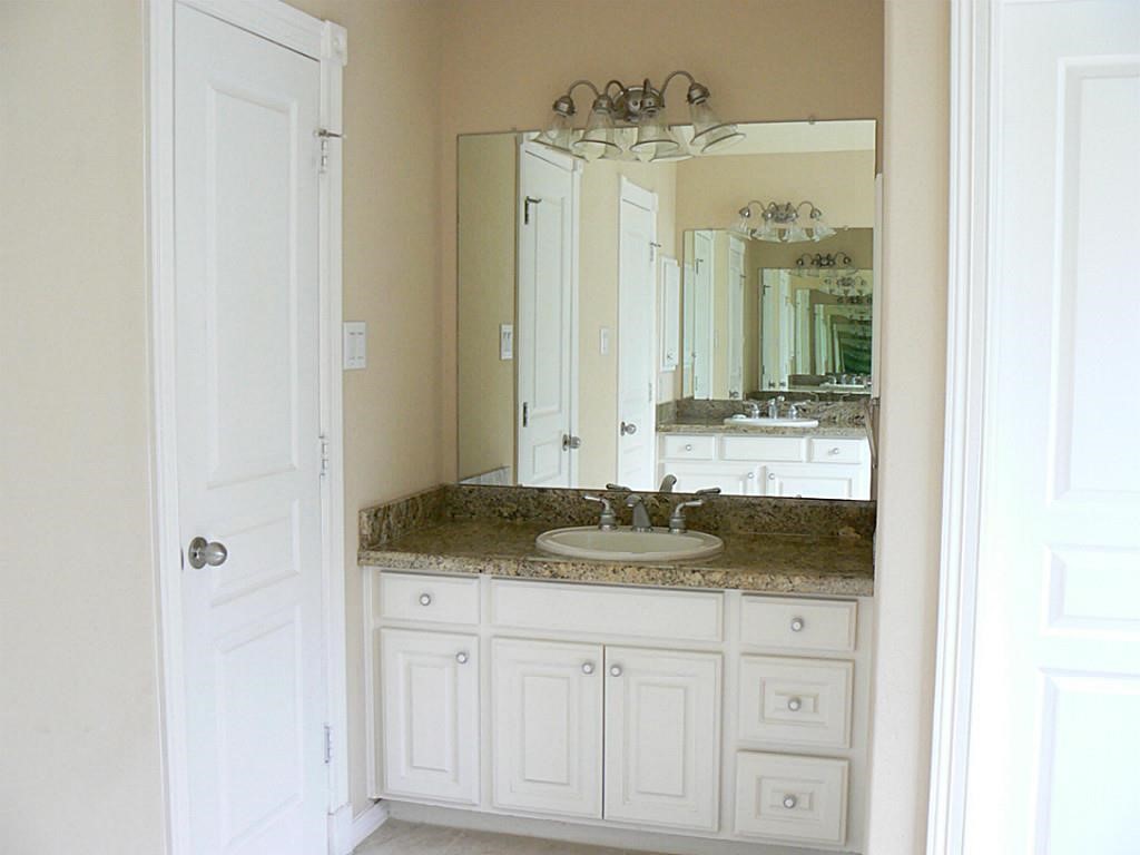 951 Lamonte Lane Houston, TX 77018 - Photo 20 of 26 a bathroom with a granite countertop sink and a mirror