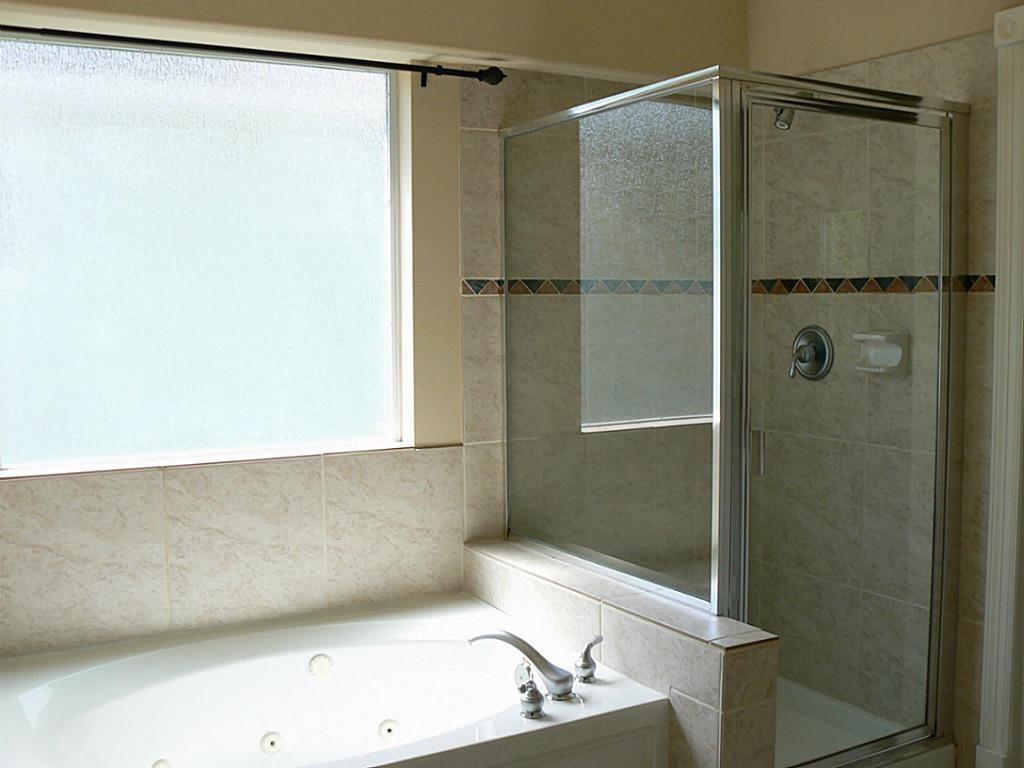 951 Lamonte Lane Houston, TX 77018 - Photo 21 of 26 a bathroom with a tub and a shower