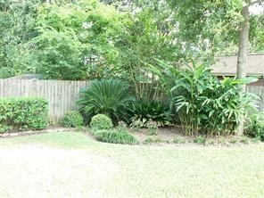 951 Lamonte Lane Houston, TX 77018 - Photo 22 of 26 a view of backyard with potted plants and wooden fence