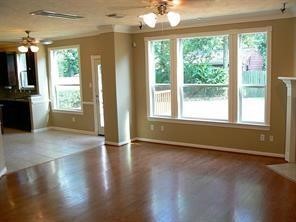 951 Lamonte Lane Houston, TX 77018 - Photo 5 of 26 a view of an empty room with wooden floor and a window