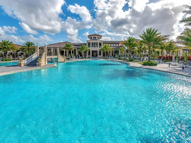 a view of outdoor space with playground and green space