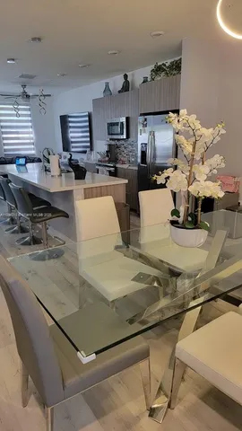 a large kitchen with a large counter top appliances and cabinets