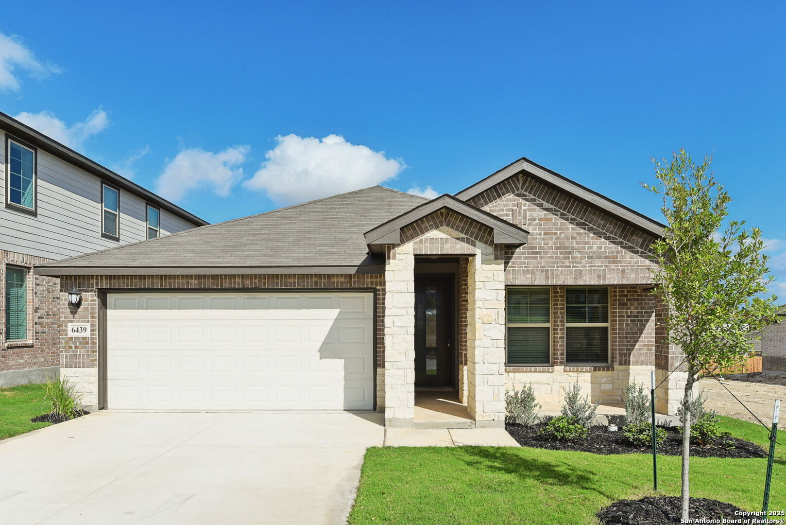 6439 Comanche Moon San Antonio, TX 78233 - Photo 1 of 1 a front view of a house with a yard