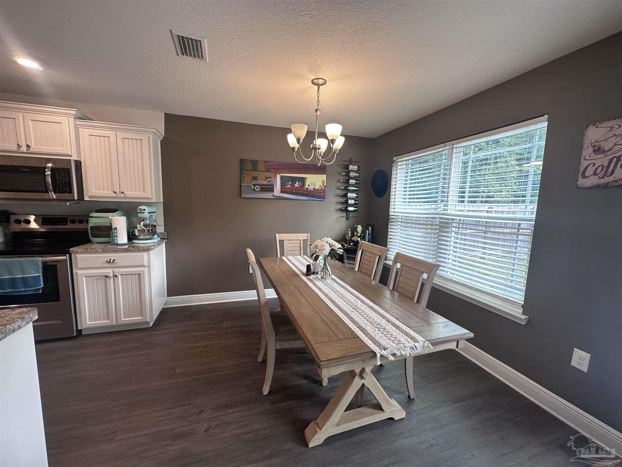 5217 Saufley Field Road Pensacola, FL 32526 - Photo 6 of 26 a dining room with furniture and window