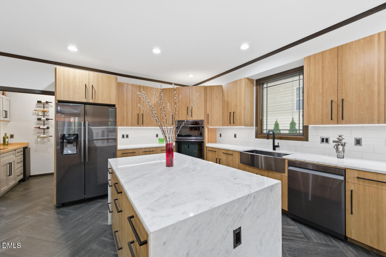 3315 Denada Path Durham, NC 27707 - Photo 17 of 74 a kitchen with refrigerator cabinets and wooden floor