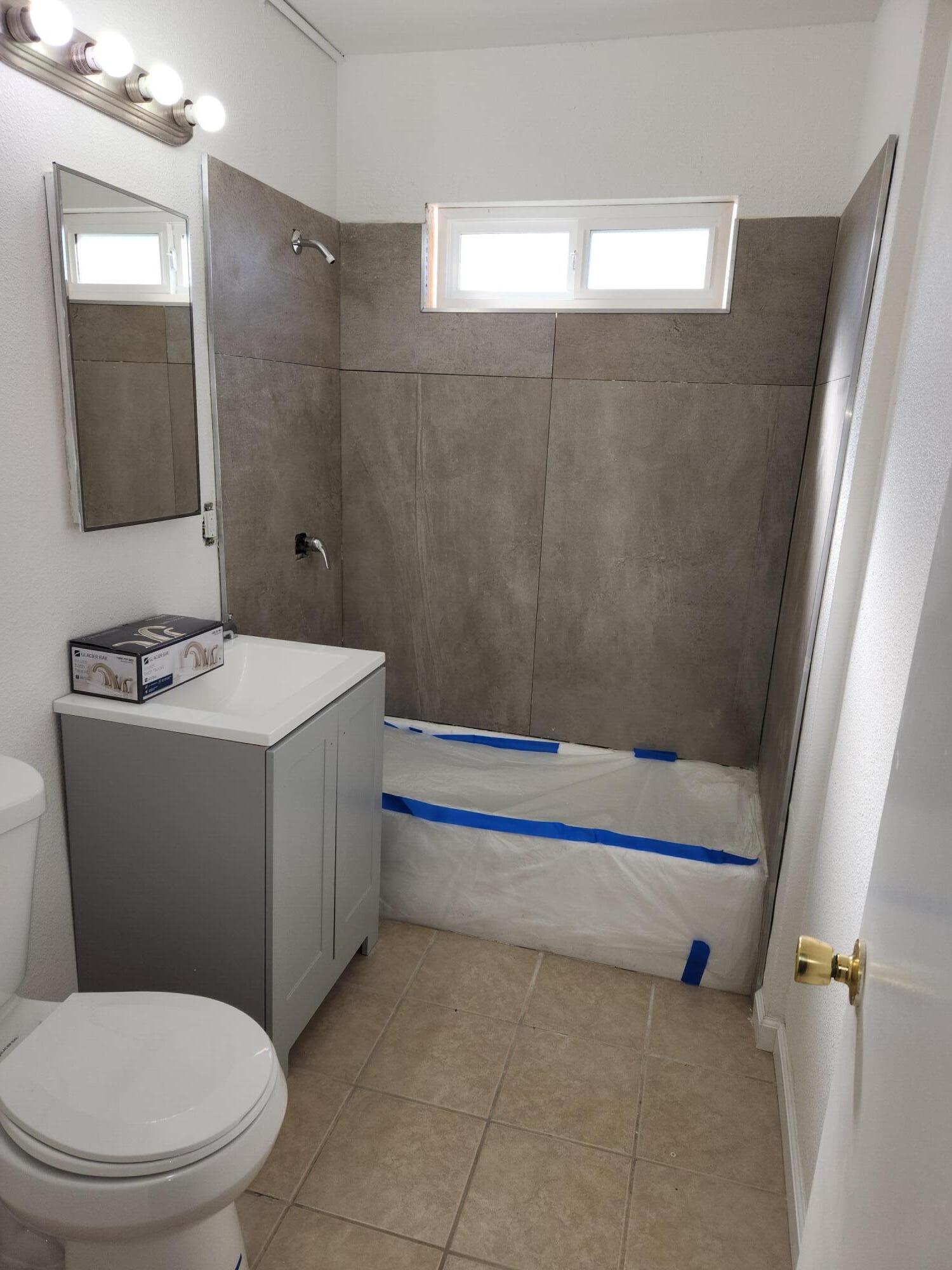 10485 Santa Cruz Road Desert Hot Springs, CA 92240 - Photo 3 of 16 a bathroom with a sink a toilet and shower