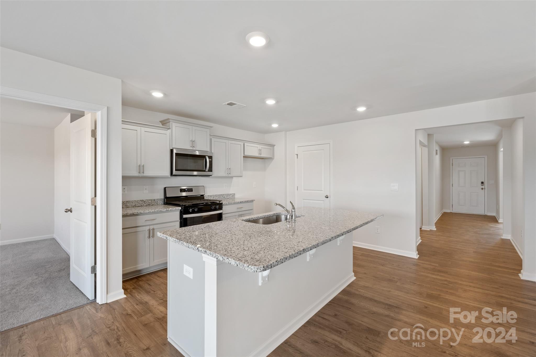 160 Callie River Clyde, NC 28721 - Photo 2 of 24 a kitchen with stainless steel appliances granite countertop a sink stove and refrigerator