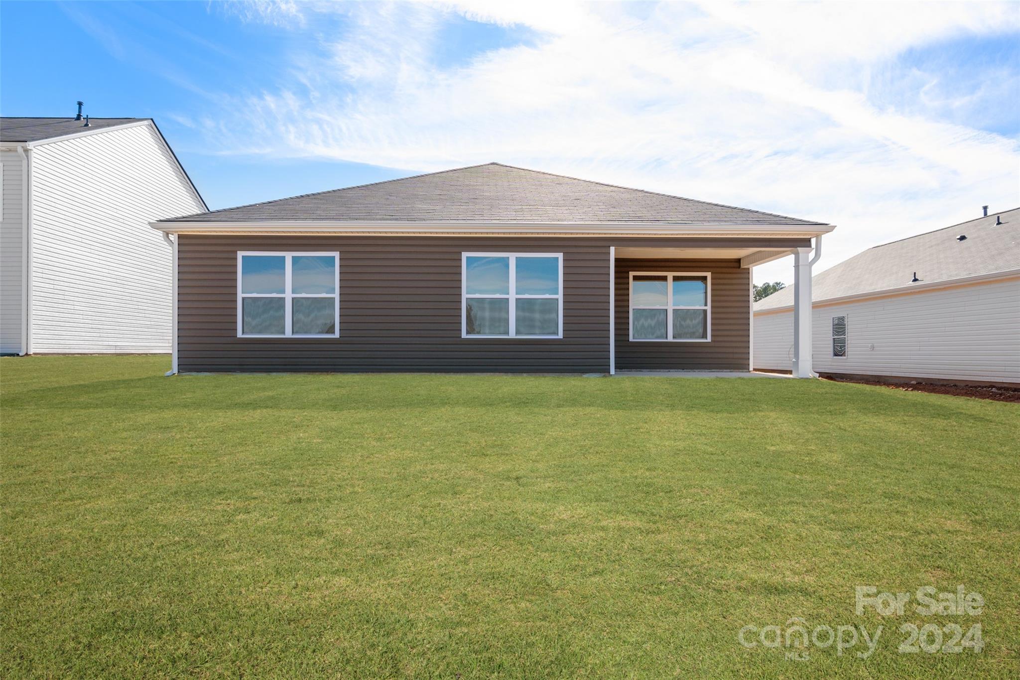 160 Callie River Clyde, NC 28721 - Photo 23 of 24 a front view of house with yard and trees in the background