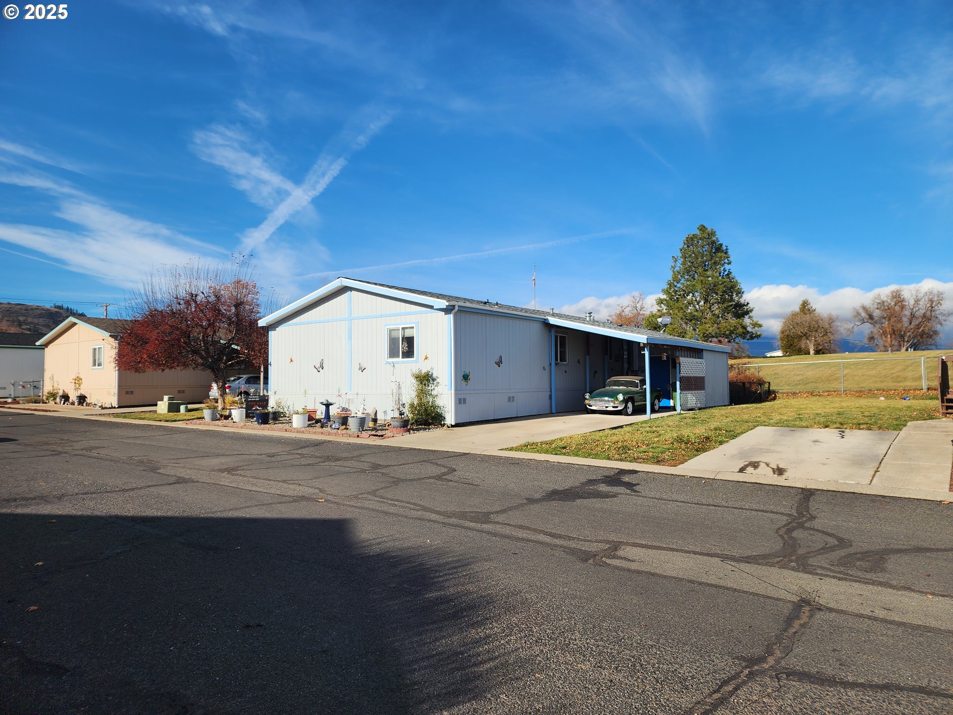 313 12th Street, Unit 4 La Grande, OR 97850 - Photo 1 of 32 a front view of a house with a yard