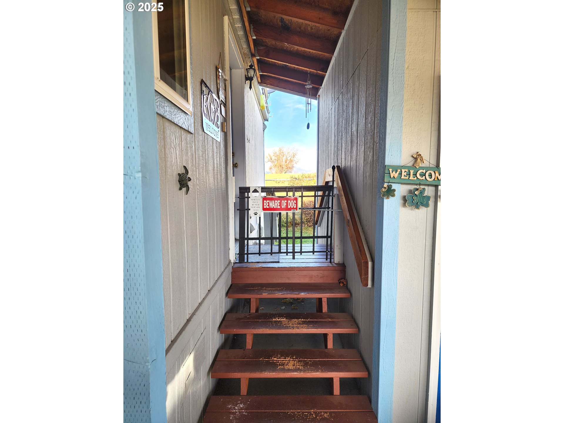 313 12th Street, Unit 4 La Grande, OR 97850 - Photo 12 of 32 a view of an entryway with a small yard