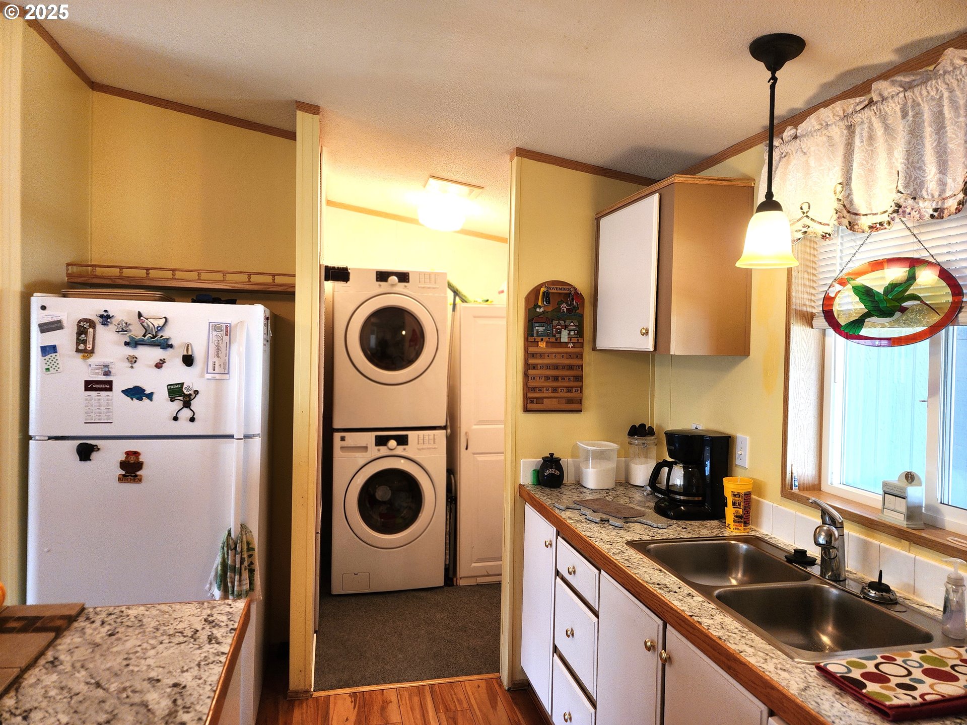 313 12th Street, Unit 4 La Grande, OR 97850 - Photo 13 of 32 a kitchen with a sink a stove and cabinets