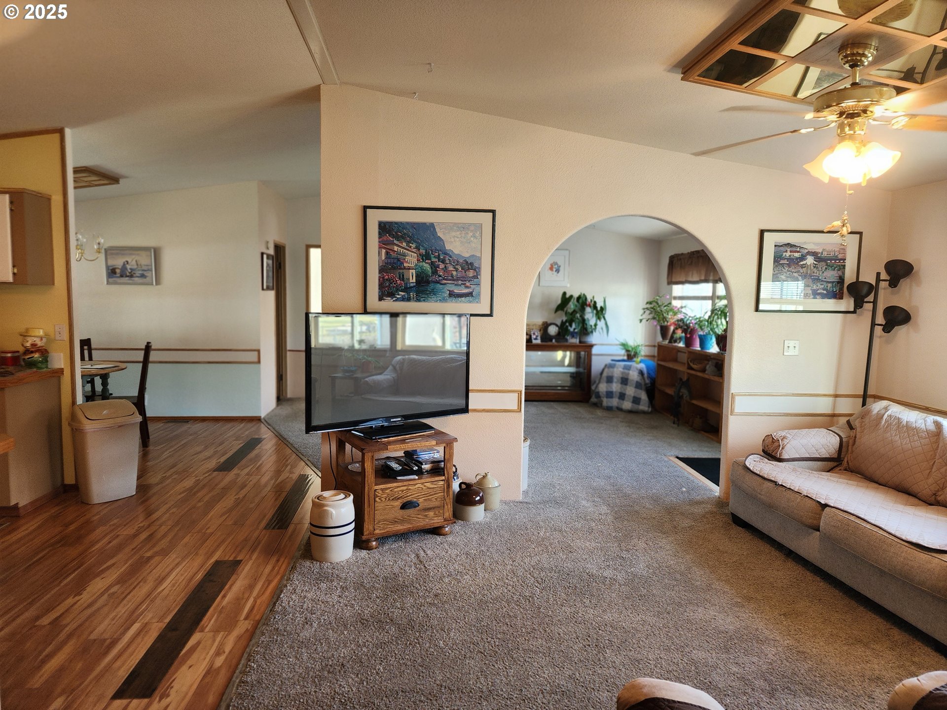 313 12th Street, Unit 4 La Grande, OR 97850 - Photo 23 of 32 a living room with furniture and a flat screen tv