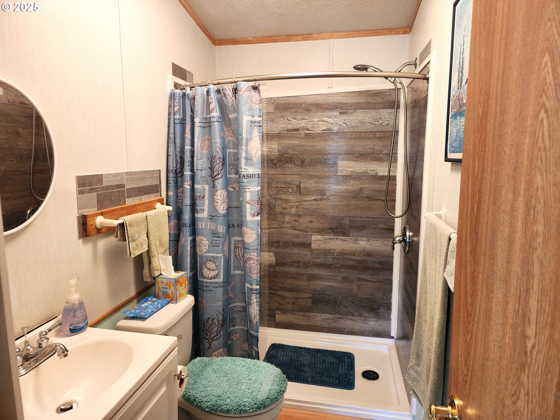 313 12th Street, Unit 4 La Grande, OR 97850 - Photo 26 of 32 a bathroom with a sink toilet and shower