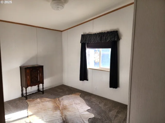 a view of livingroom with furniture and closet