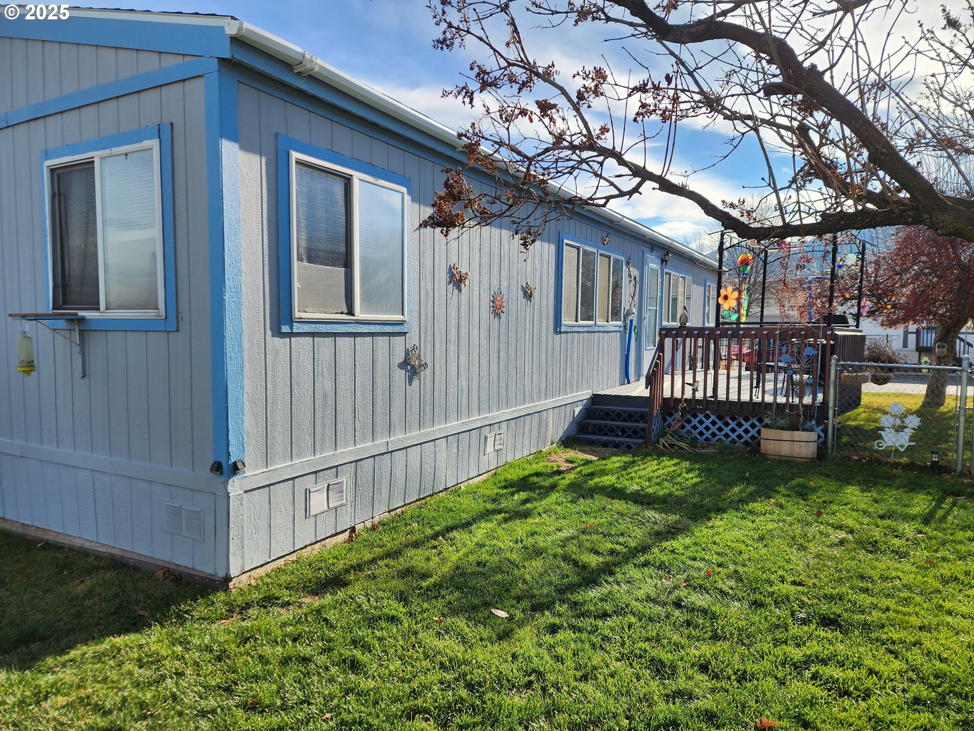 313 12th Street, Unit 4 La Grande, OR 97850 - Photo 10 of 32 a view of a house with a yard