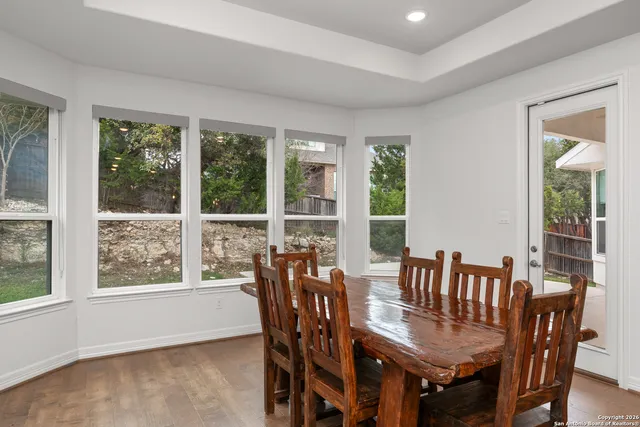 a view of a dining room with furniture window and outside view
