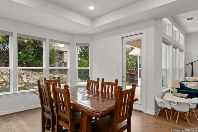 a view of a dining room with furniture window and outside view