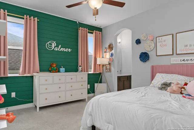 a bedroom with a bed and a dresser