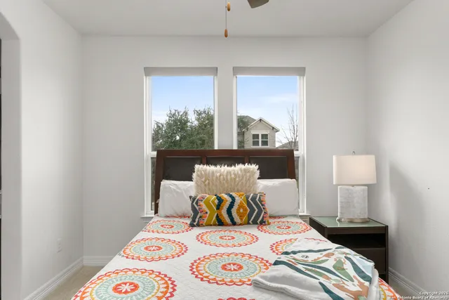 a bedroom with a bed and window