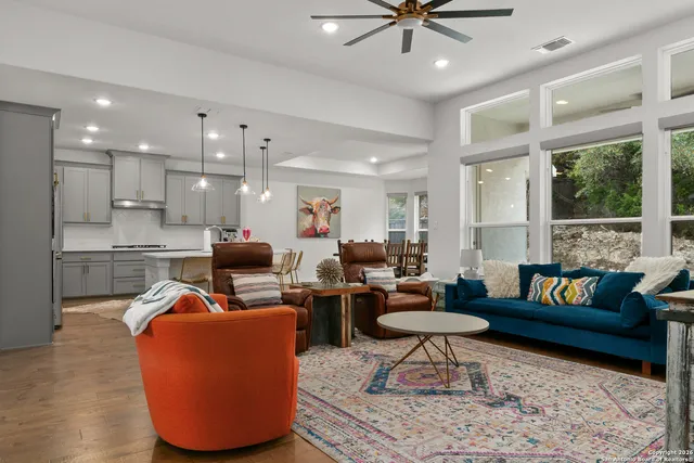 a living room with furniture and a large window