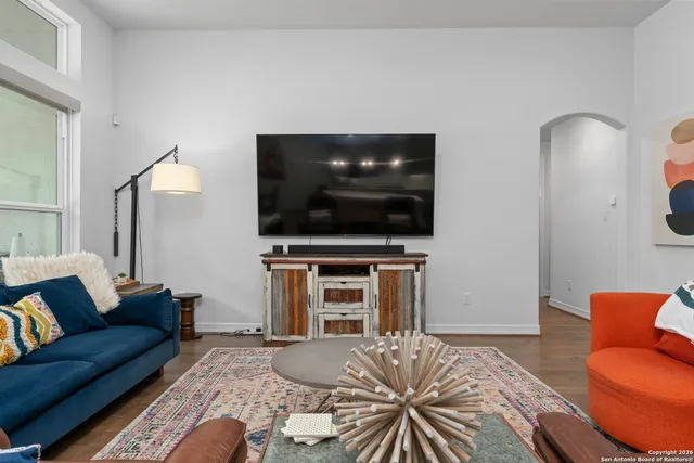 a living room with a flat screen tv and a couch