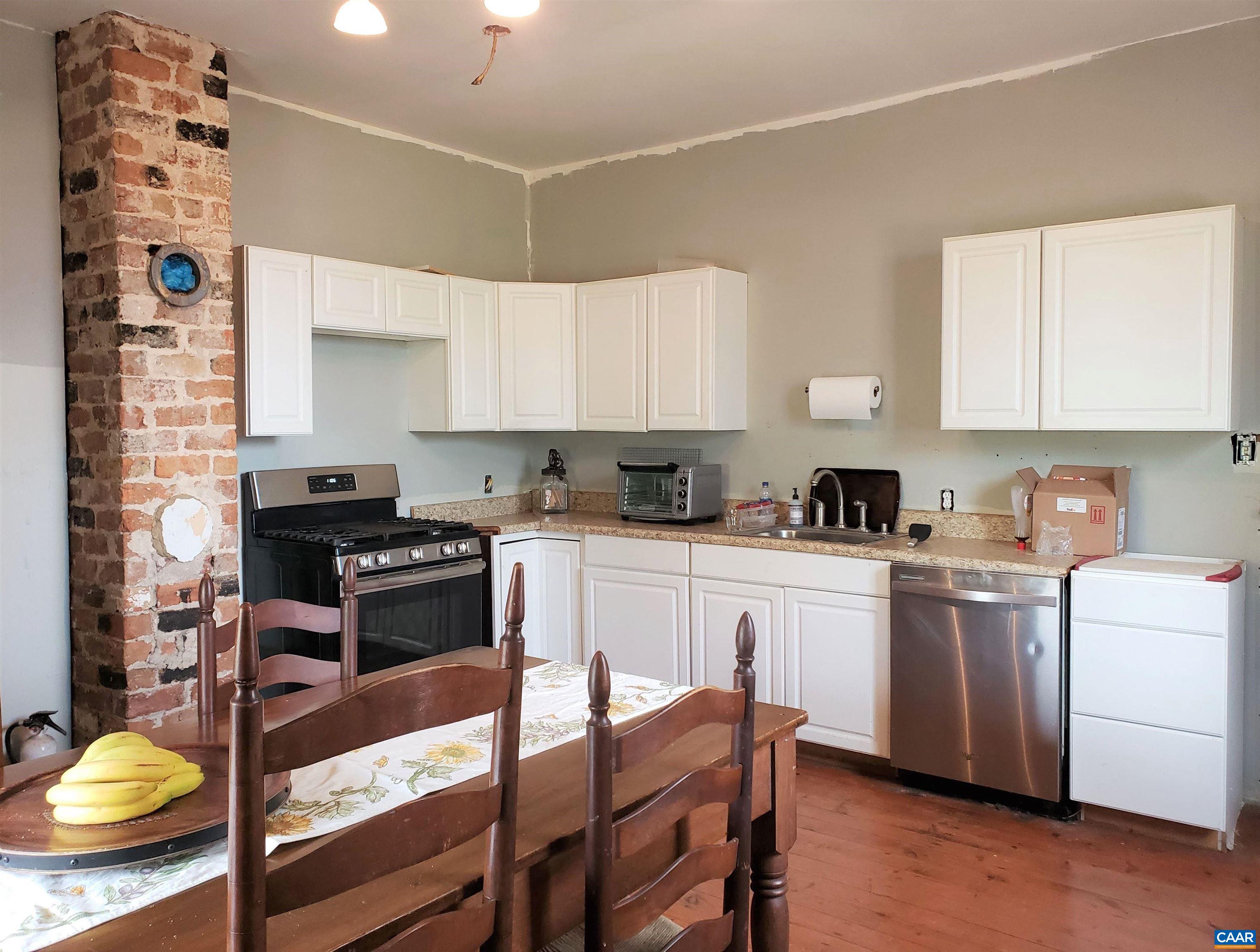 Double Run Road Madison, VA 22727 - Photo 8 of 26 a kitchen with stainless steel appliances granite countertop a stove refrigerator sink and cabinets