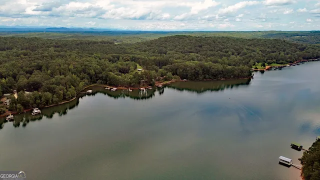 a view of outdoor space with seating area and lake view