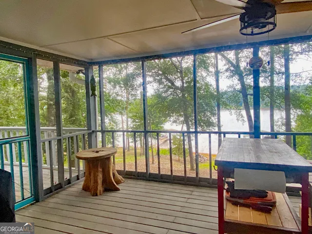 a view of a room with wooden floor and city view