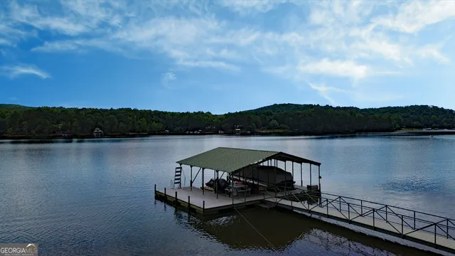 a view of a lake with a car parked