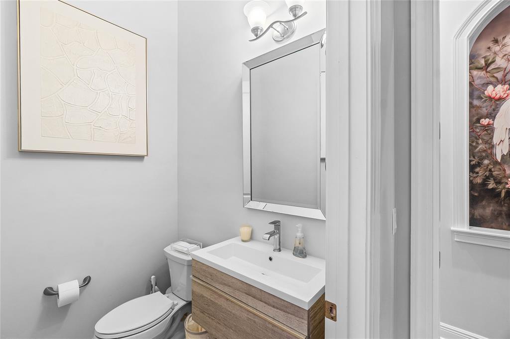 6375 Bellamalfi Street Boca Raton, FL 33496 - Photo 15 of 25 a bathroom with a toilet sink and mirror